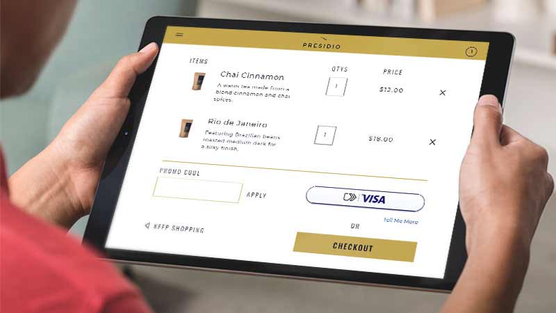 photo of someone using the click pay at the online checkout with Visa on a tablet